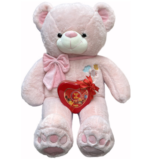 Pink bear in pink bow with bon o bon chocolate